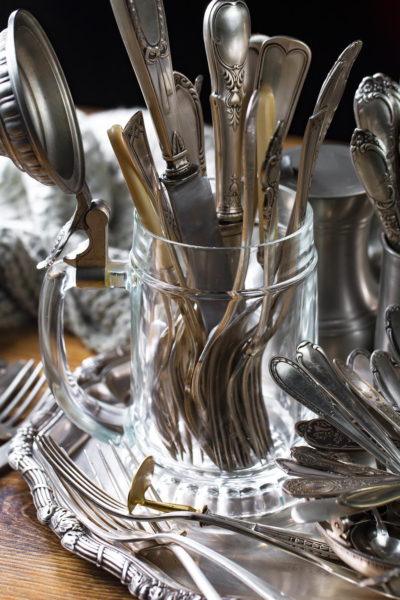 Tools and modern kitchen instruments on stainless surface